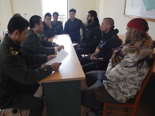 A group of people sitting around a table

Description automatically generated